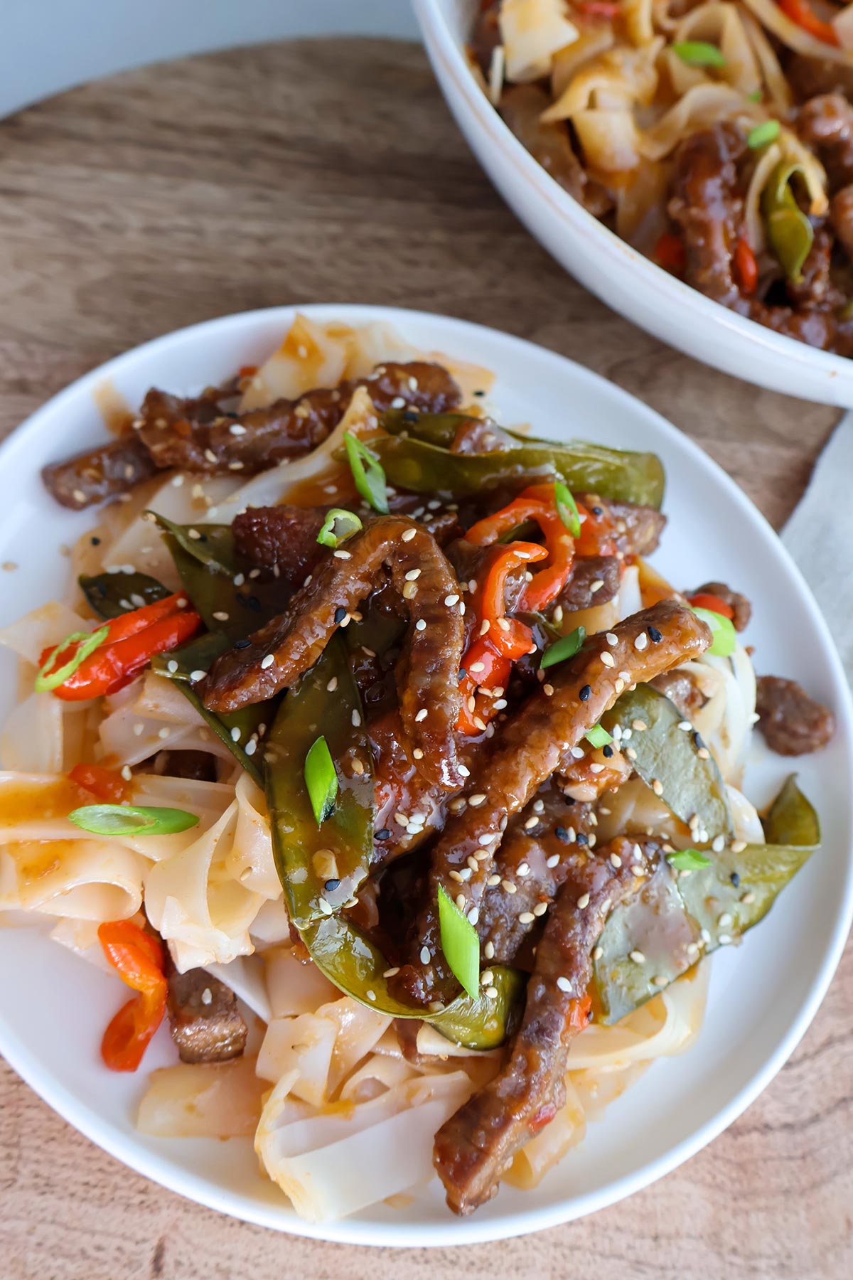 Overhead shot of plateful of crispy chilli beef strips.
