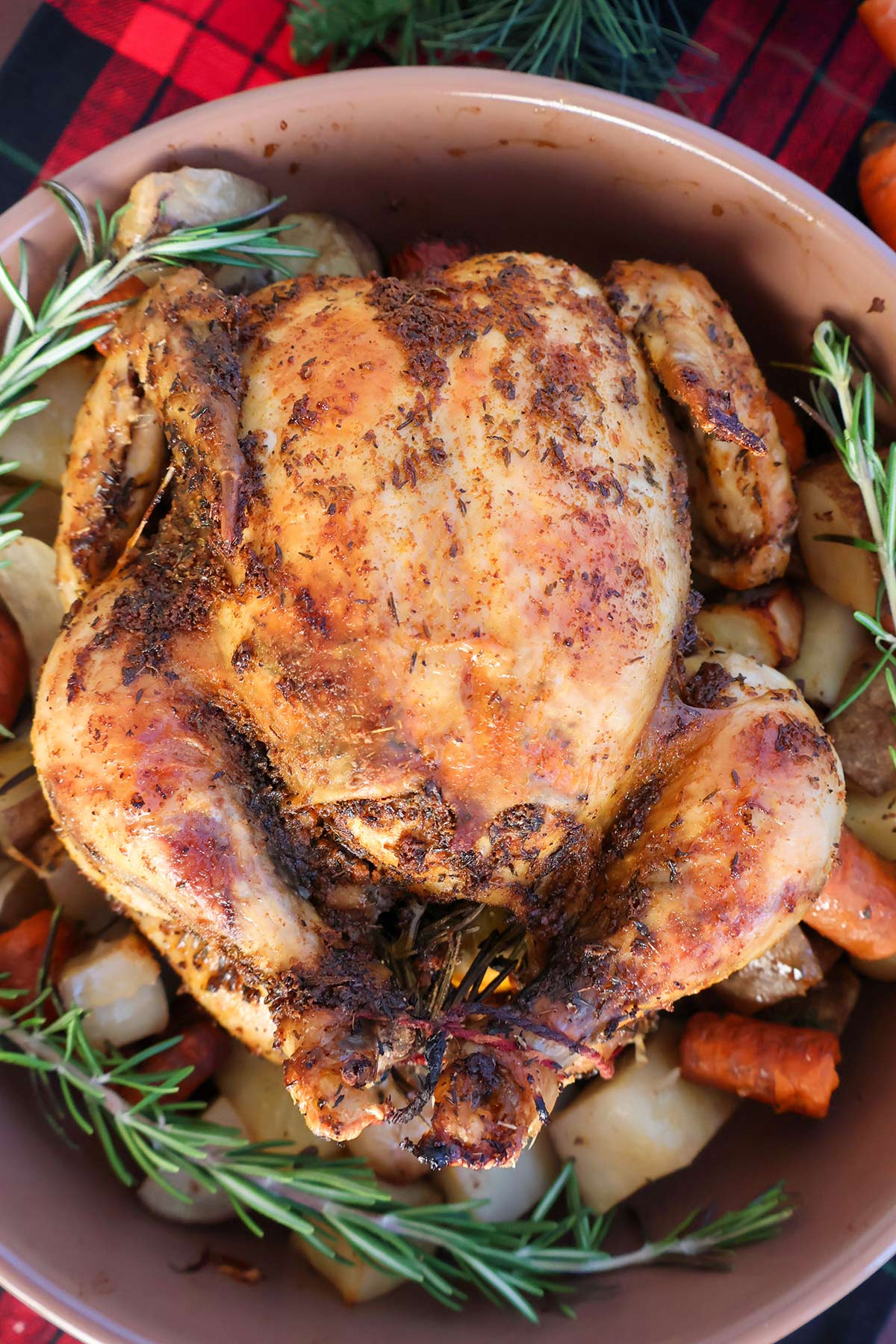 Overhead shot of whole chicken cooked chicken in a crockpot. 
