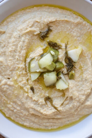 Overhead shot of bowlful of dill pickle hummus.