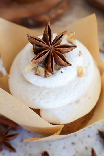 Closeup shot of frosted pumpkin muffin.