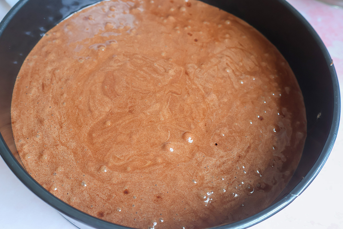 Pan with chocolate cake batter.