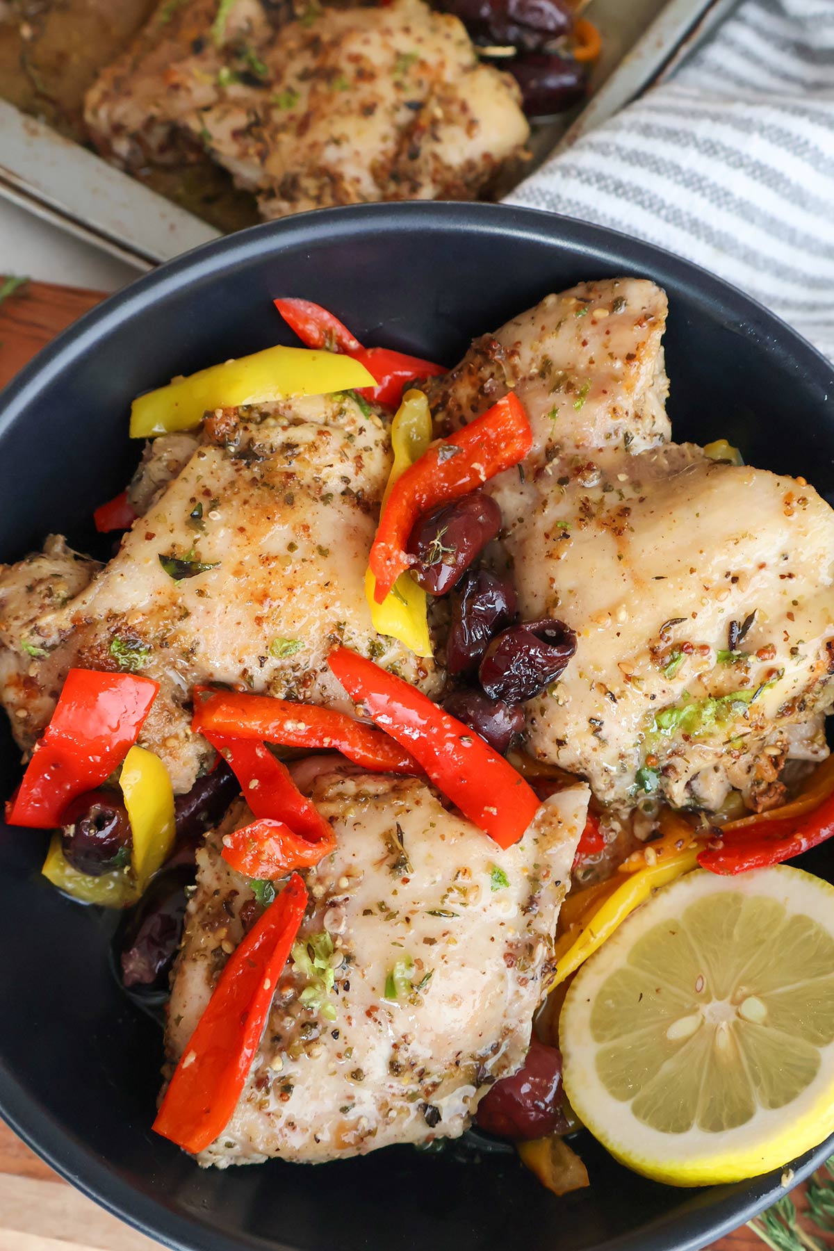 Plateful of chicken thighs and vegetables.
