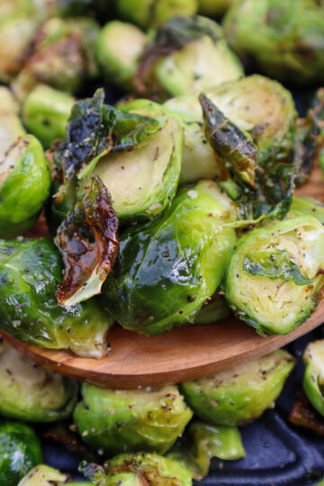 Closeup shot of spoonful of air-fried brussle sprouts.