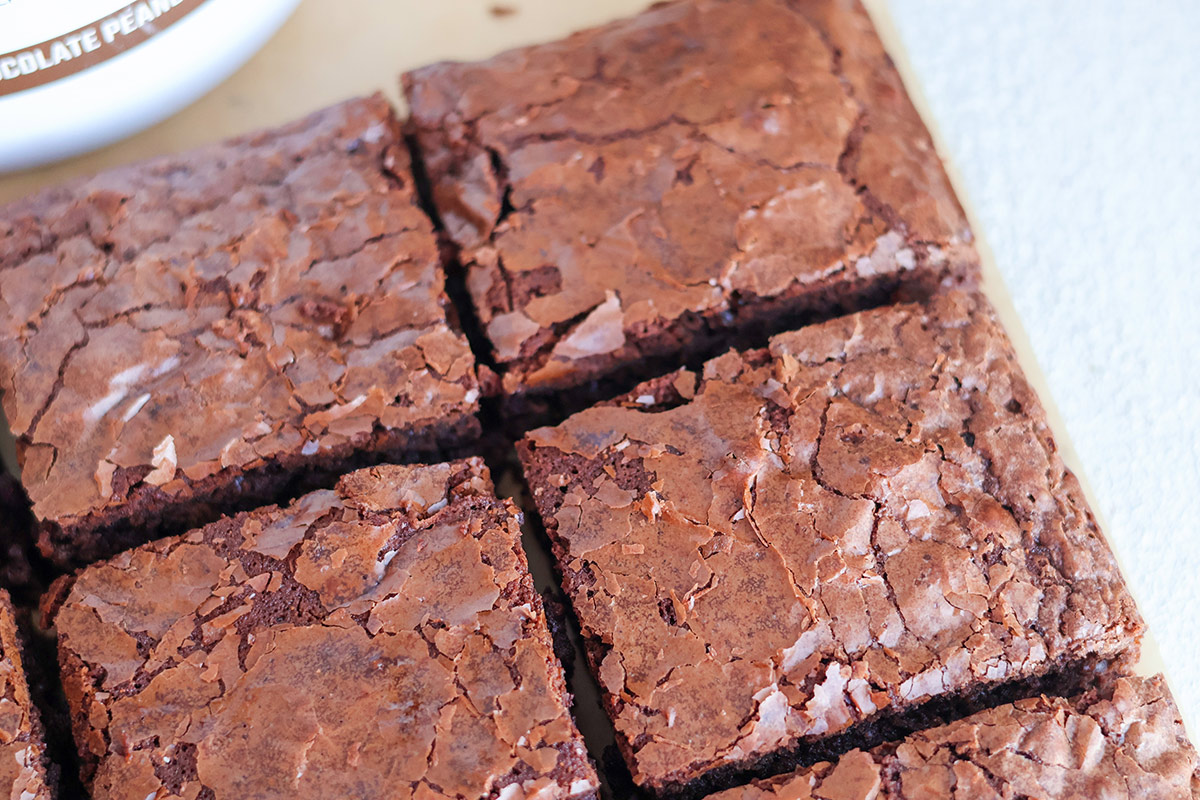 An overhead shot of sliced browneis on cutting board.