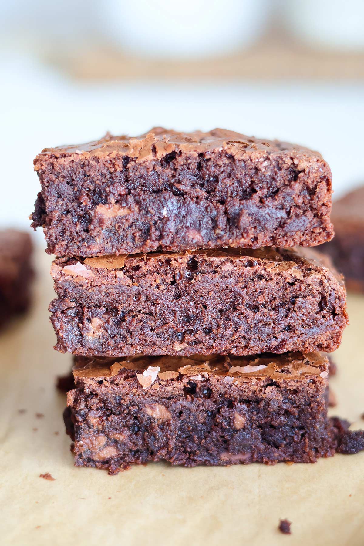 A stack of three fudgy brownies.