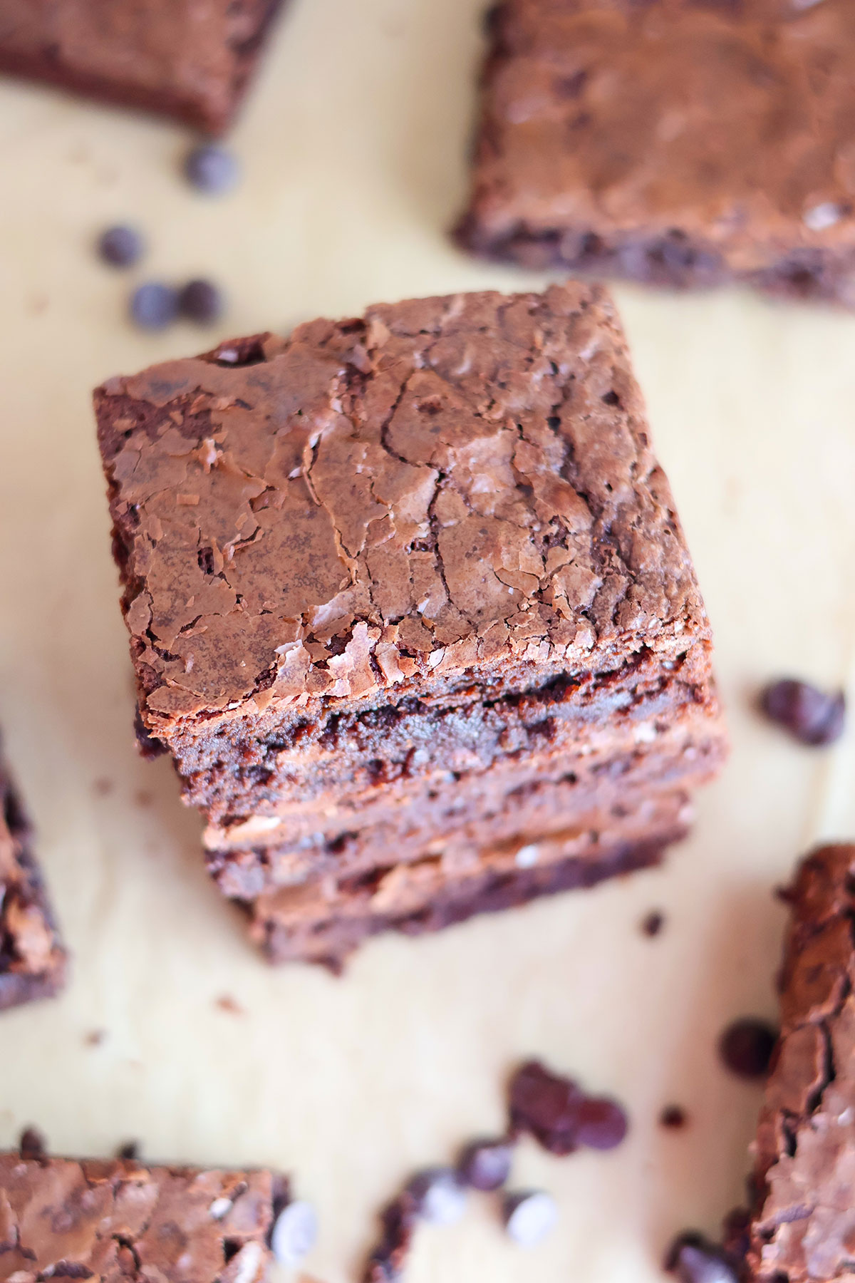 An overhead shot of a stack of brownie squares.