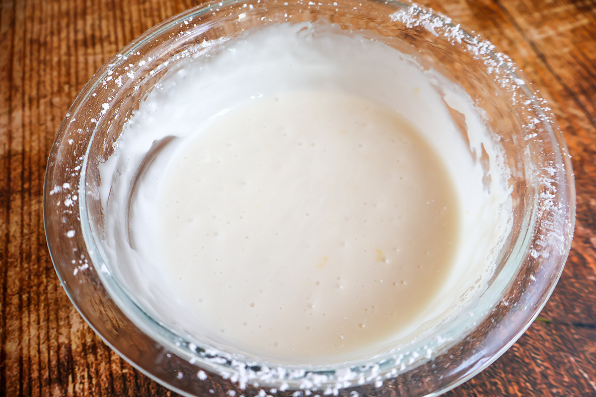 Lemon frosting in a glass bowl. 