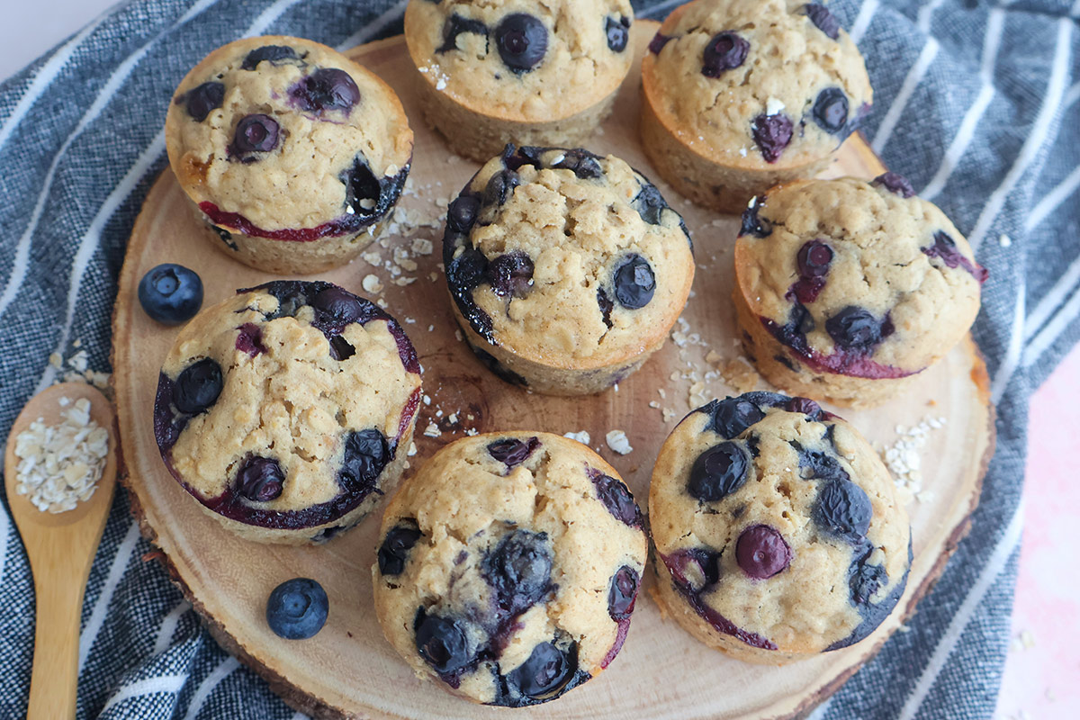 Blueberry muffins in a wooden board.