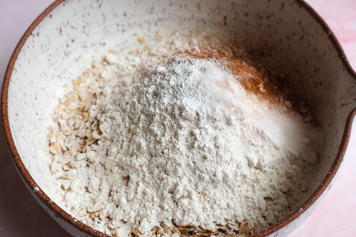 Dry muffin ingredients in a bowl.