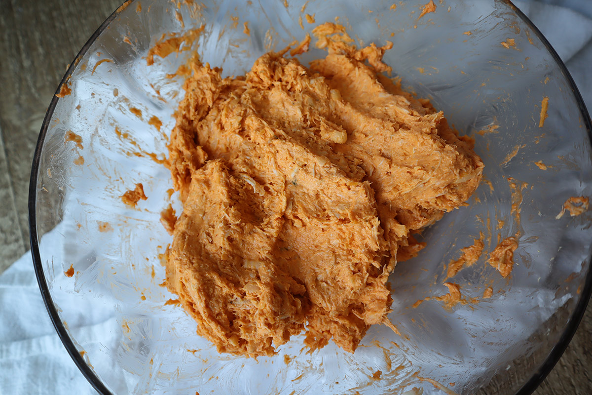 Stuffed poblano filling in a glass bowl.