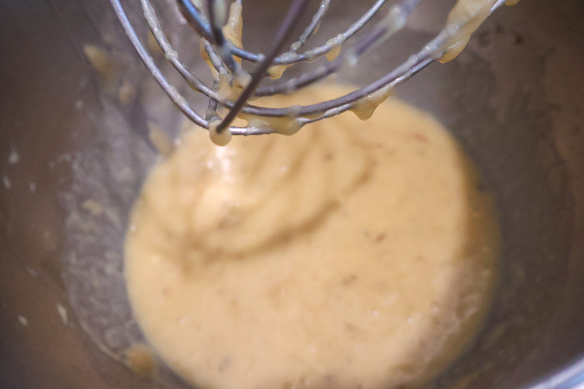Wet banana muffin ingredients in a mixing bowl.