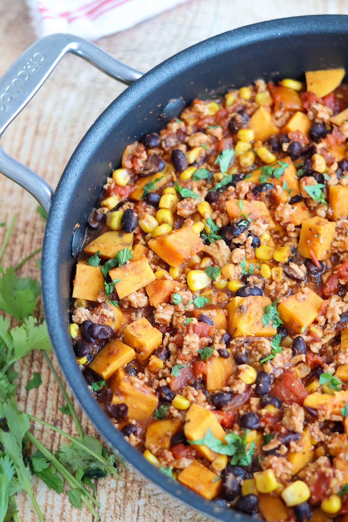 A skillet full of chicken sweet potato hash.