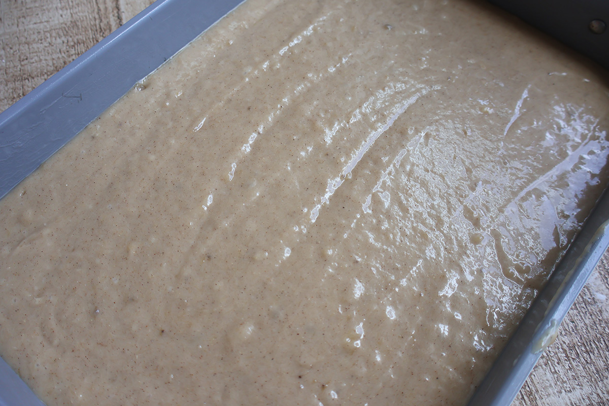 Banana cake batter in a baking pan.