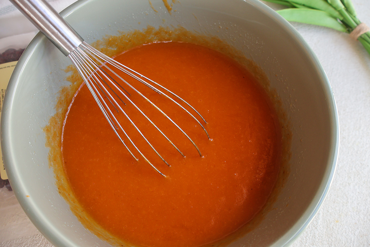 A mixing bowl with pumpkin puree.