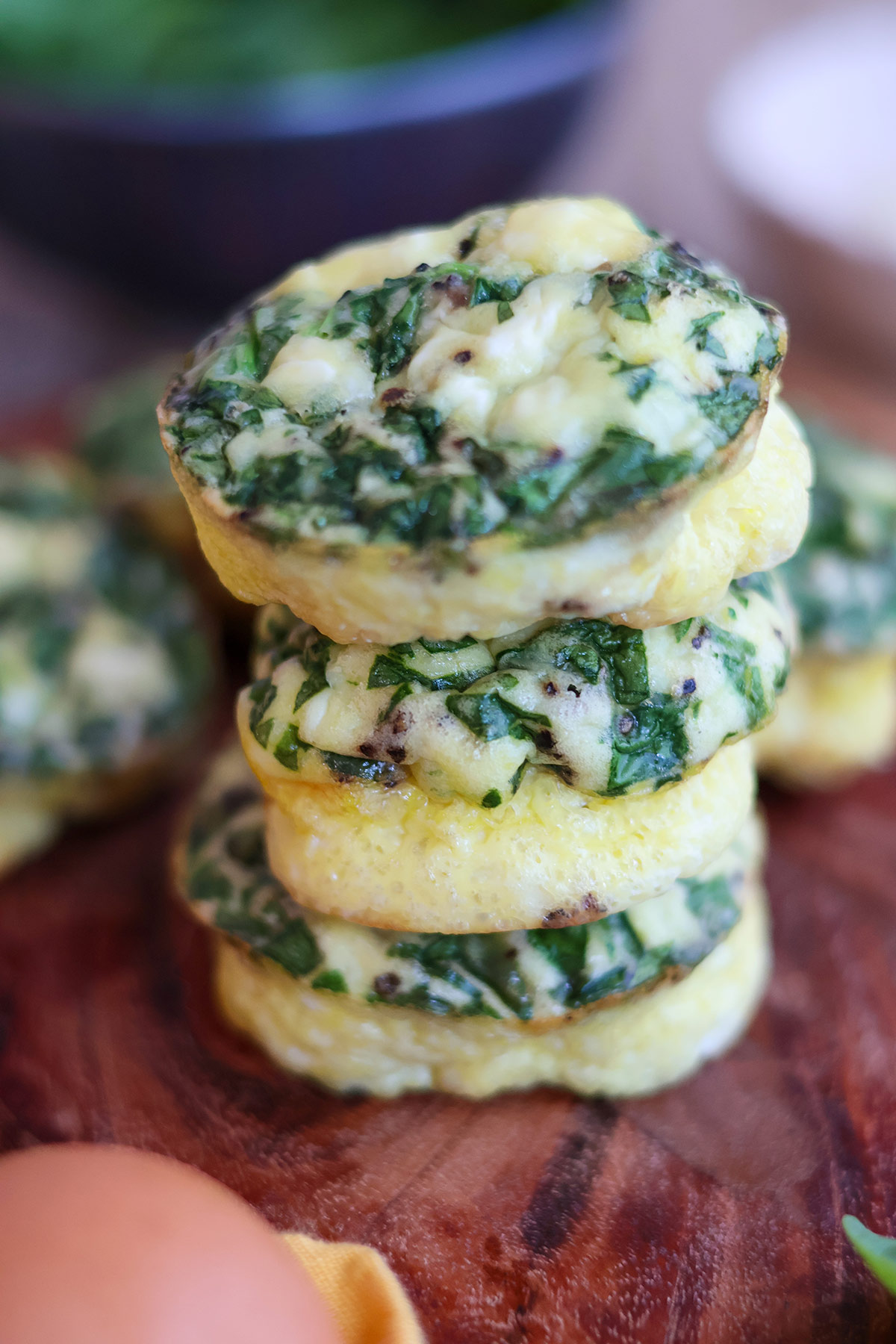 Three spinach egg cups stacked atop one another. 